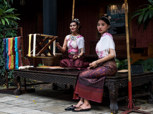 Women wearing traditional Thai silk dresses