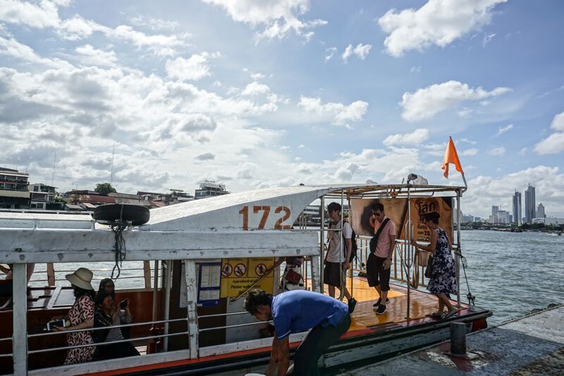 Chao Phraya river boat leaving from pier