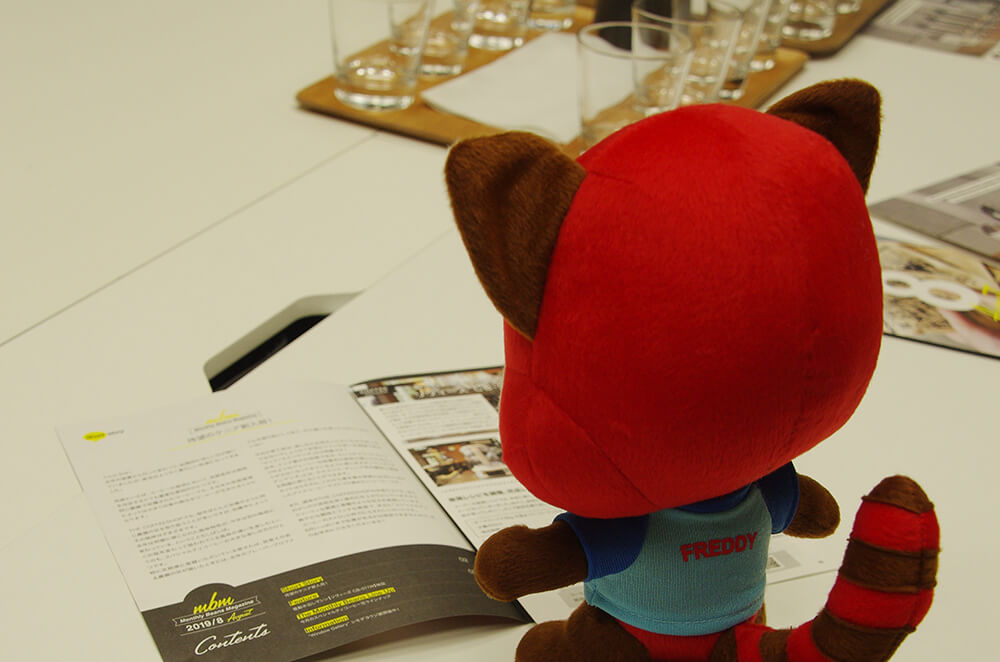 Freddy reading a coffee magazine
