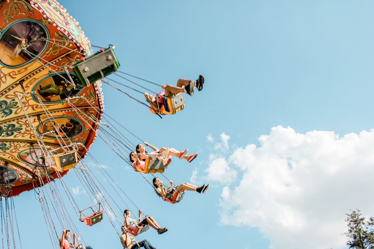 Kids in a swing ride at an amusement park