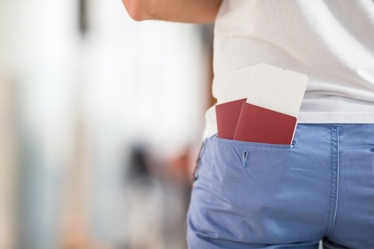 Passports in a man's back pocket