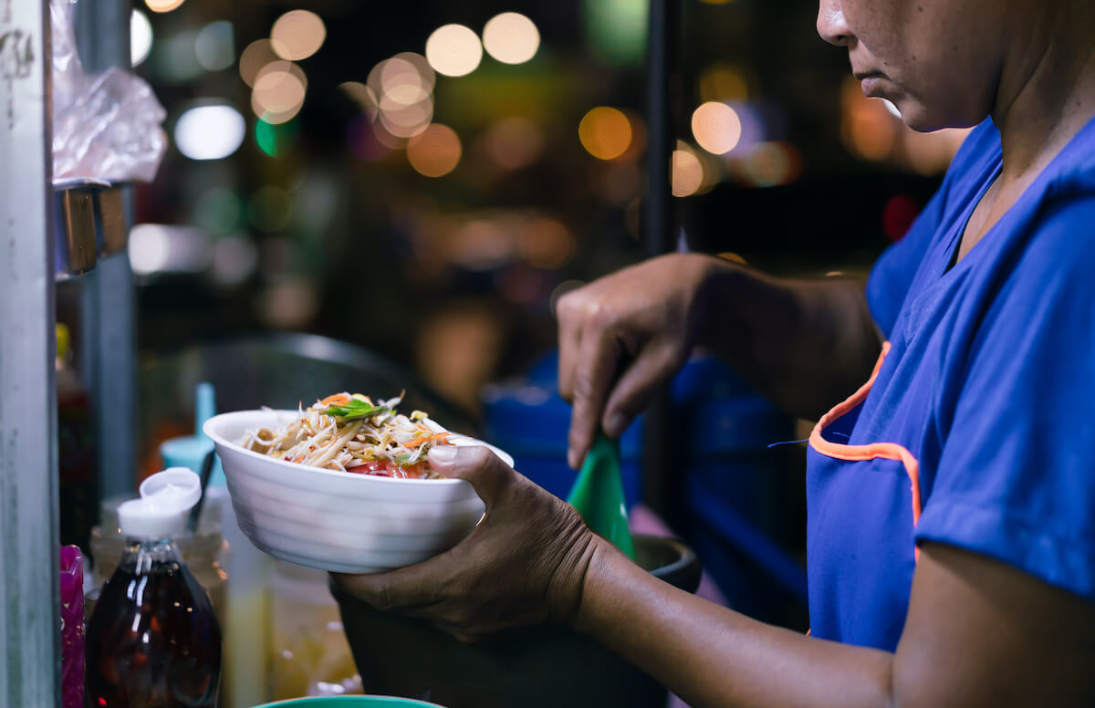 Street vendor preparing food in Thailand